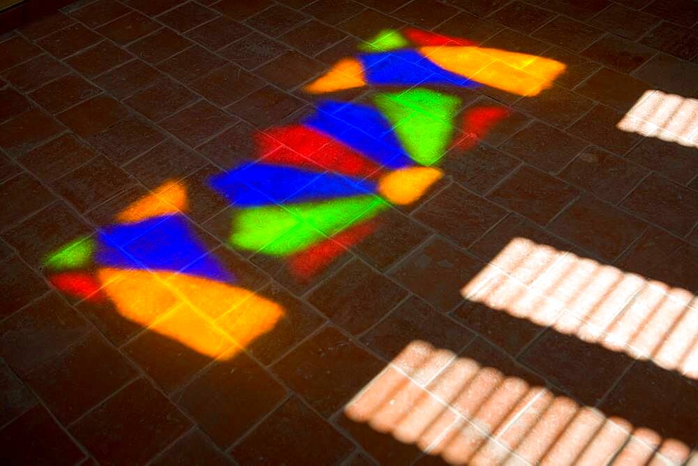 Close up of coloured light reflected through stained glass, Cuba