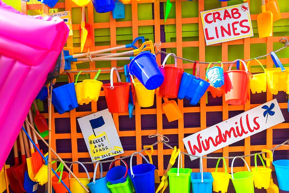 Bucket and spades and other beach items for sale, holiday resort, England, United Kingdom