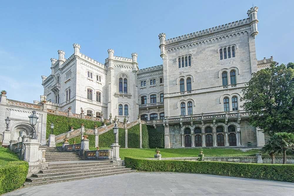 Exterior of Miramare Castle with lawns and steps, Trieste, Italy.