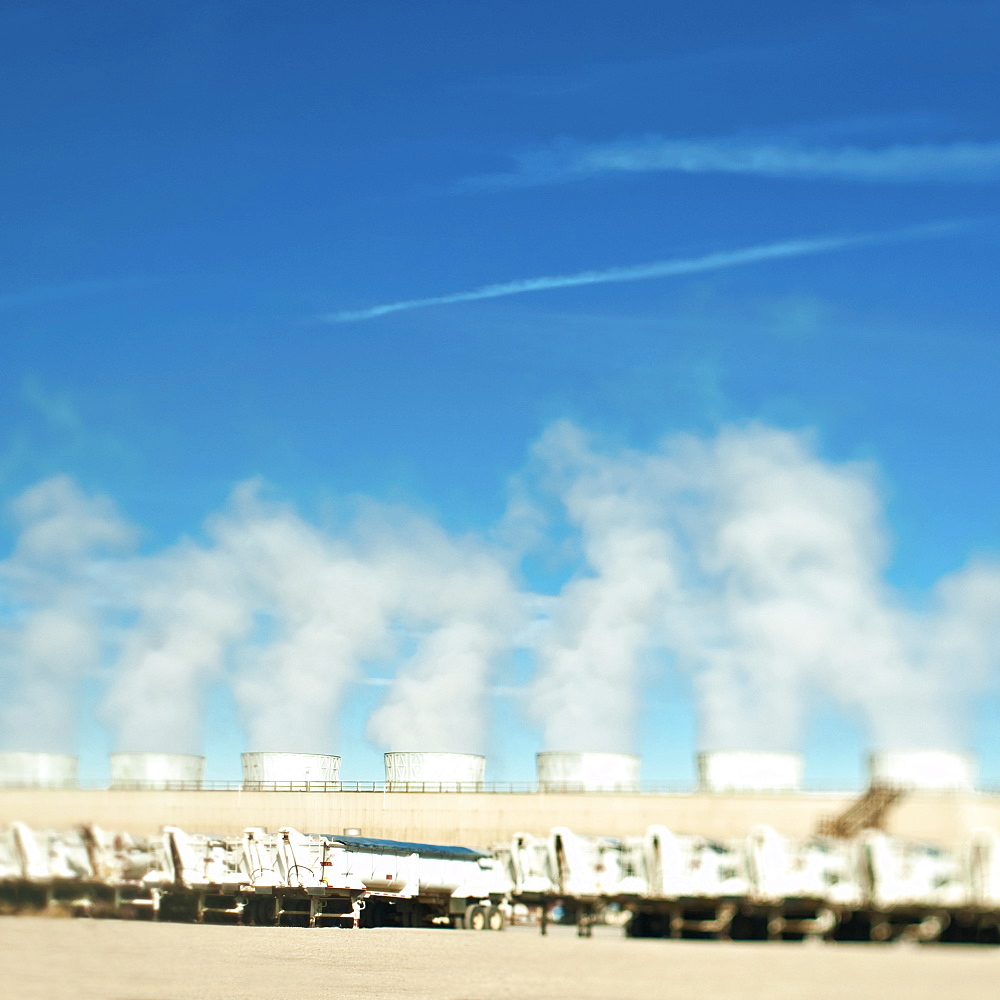 Smoke coming from power plant chimneys in desert