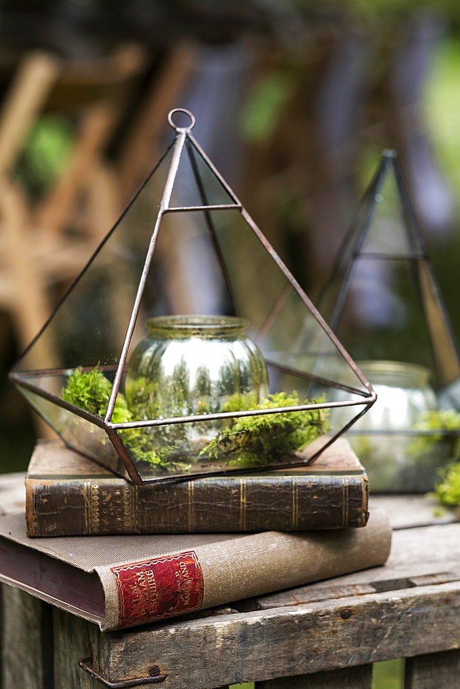 Antique books and candle holder, decorations for a woodland naming ceremony