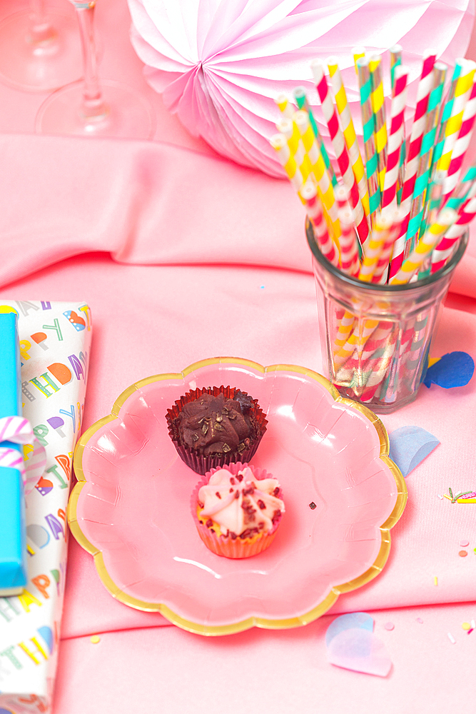 Birthday party table, with pink tablecloth