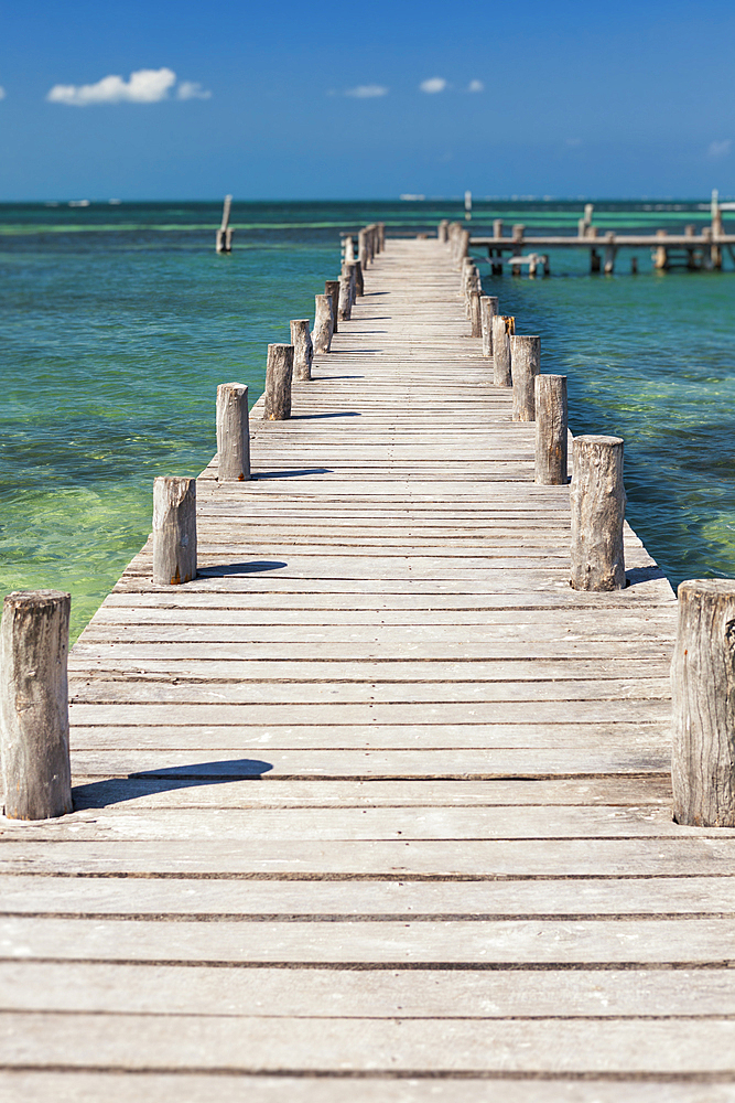 A long wooden jetty or pier, stretching out over the water