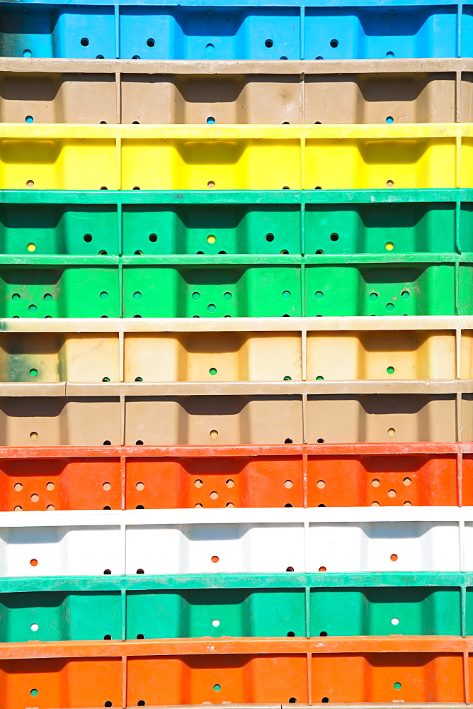 Stacks of multi-colored containers used for harvesting grapes, Washington State, USA