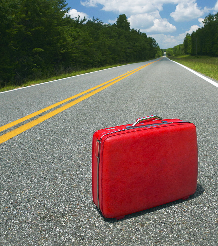 Red Suitcase Abandoned in Road, Georgia, USA