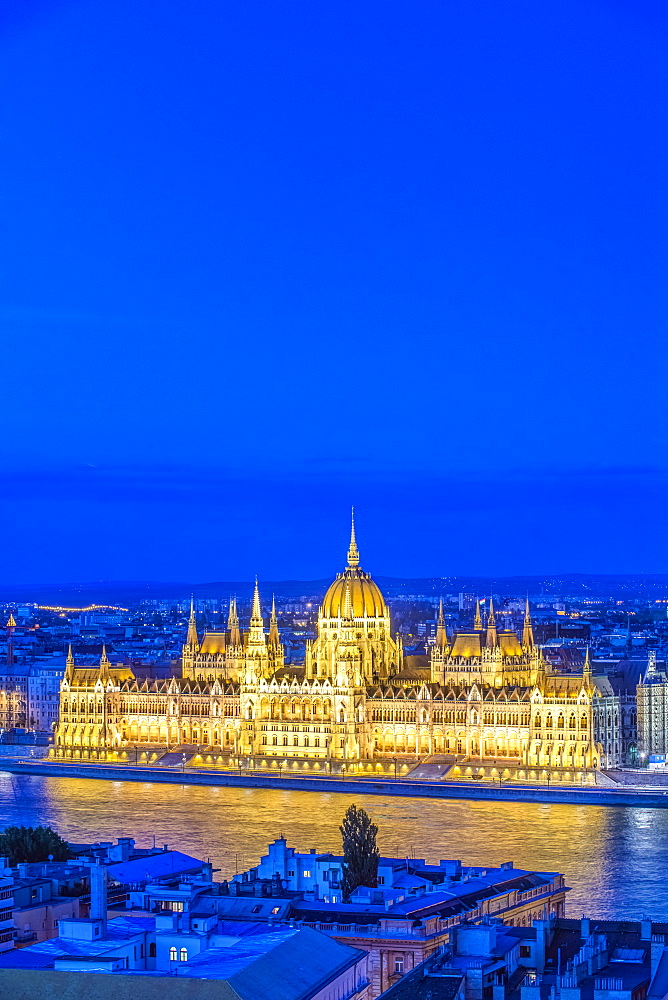 View of Parliament Building illuminated at dusk, Budapest, Hungary