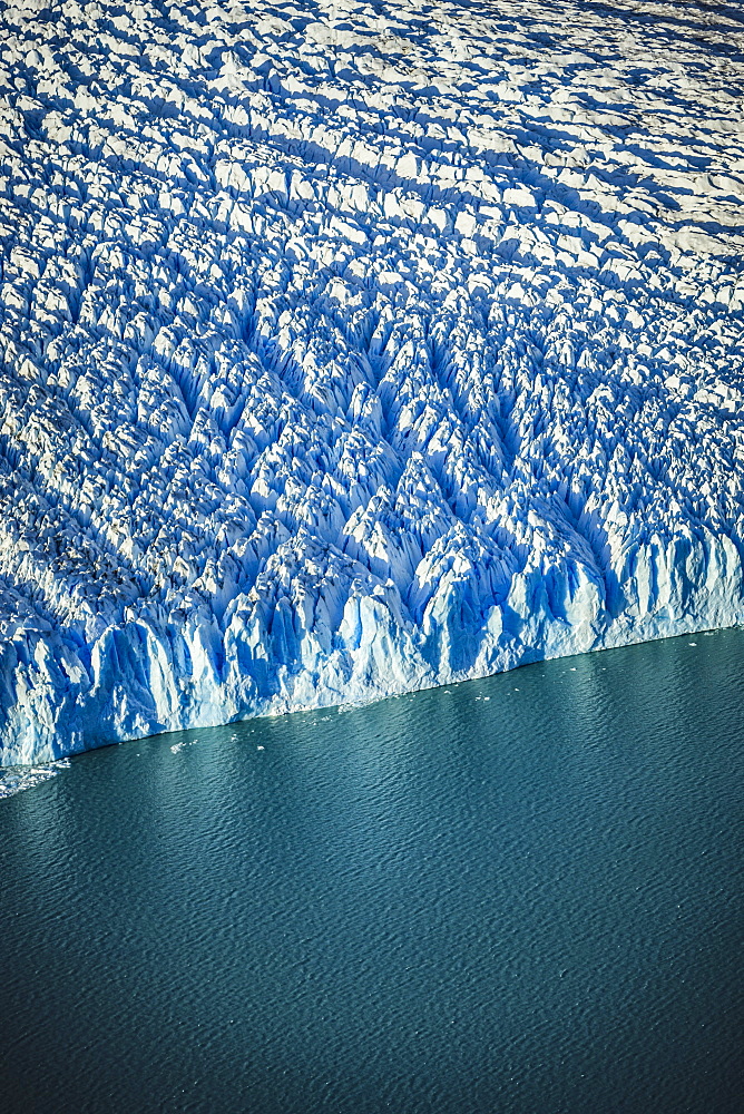 Aerial view of glacier's edge and water