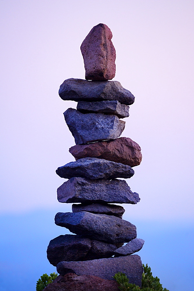 Rocks stacked neatly in rural landscape