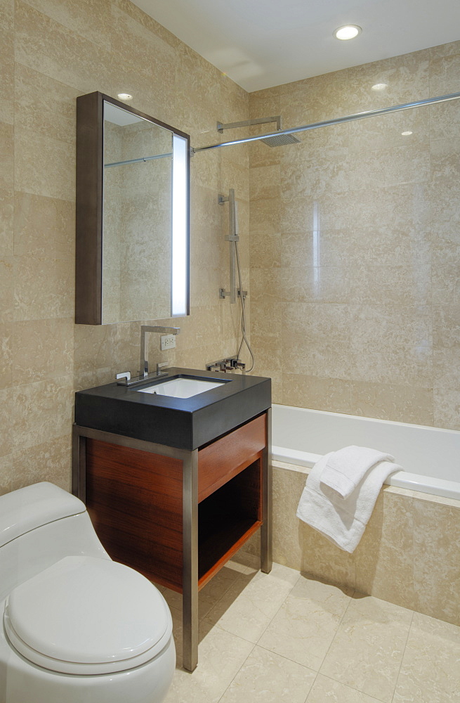 Sink, toilet and bath of modern bathroom