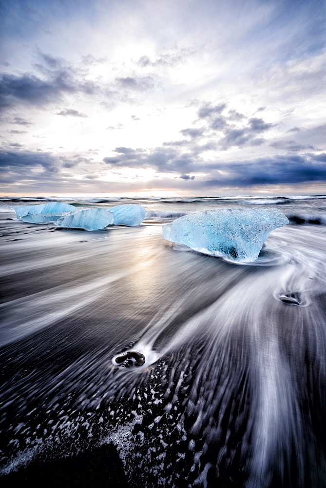 Glaciers washing up on remote beach, Jokulsarlon, Iceland