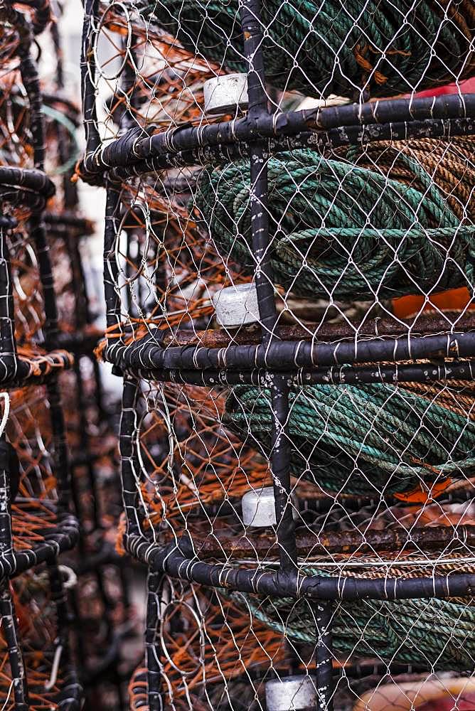 Crab and lobster pots stacked up on the quayside, close up