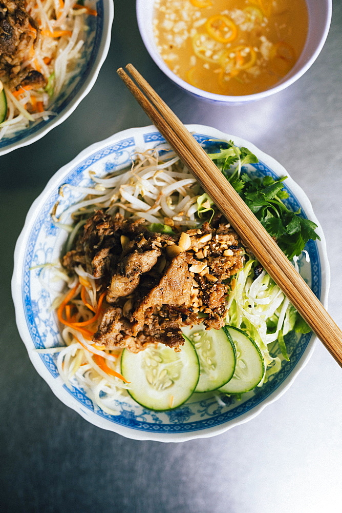 High angle close up of Bun thit nuong-rice noodles with grilled pork and fresh herb, Vietnam