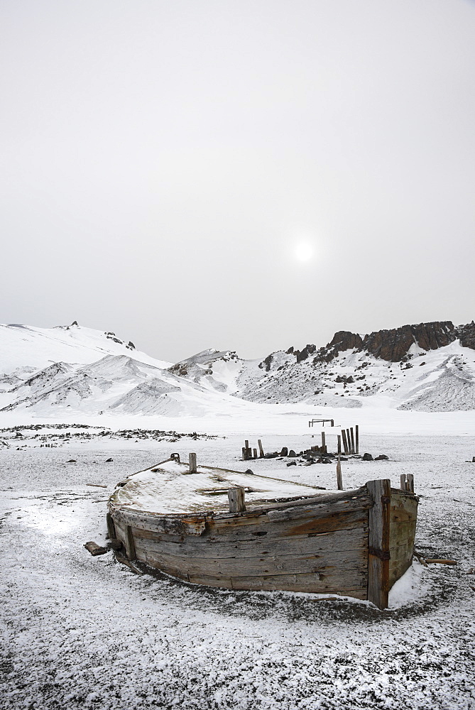 A wooden boat hull beached on Deception island, a former whaling station, Deception Island, South Shetland Islands, Antarctica