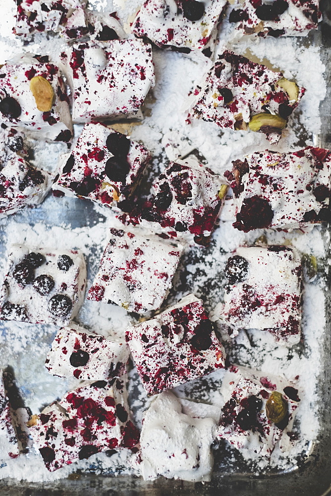 Christmas baking, close up of slices of a traybake with berries and nuts