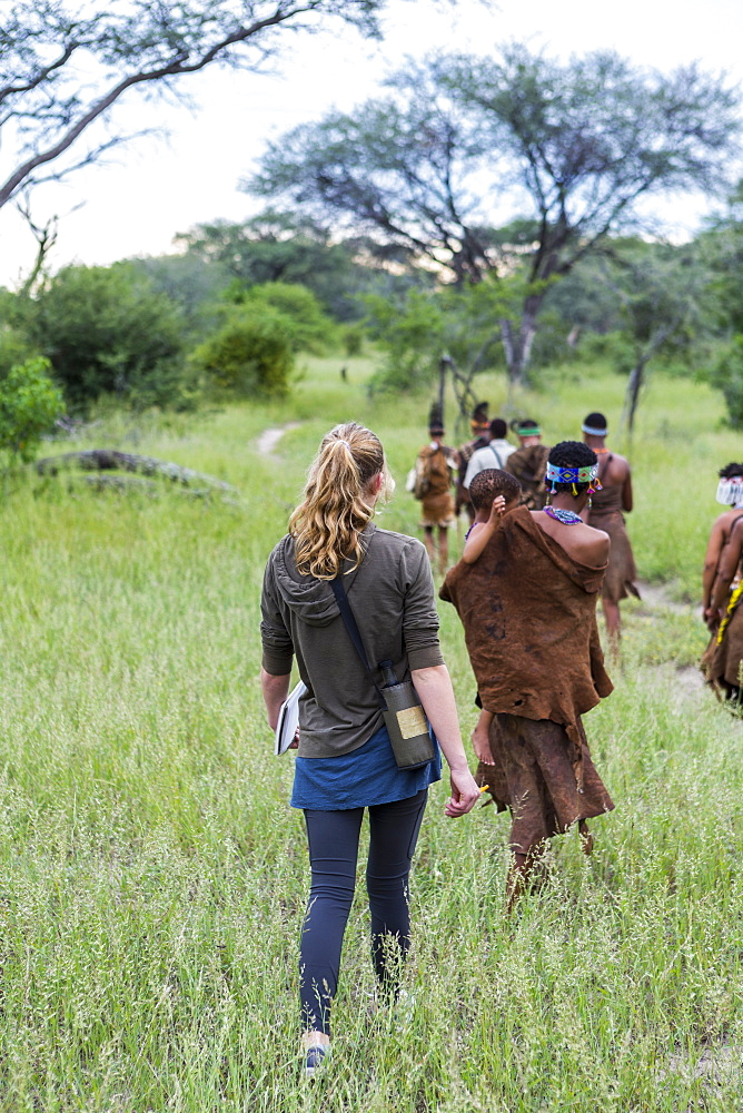 Tourists on a walking trail with members of the San people, bushmen