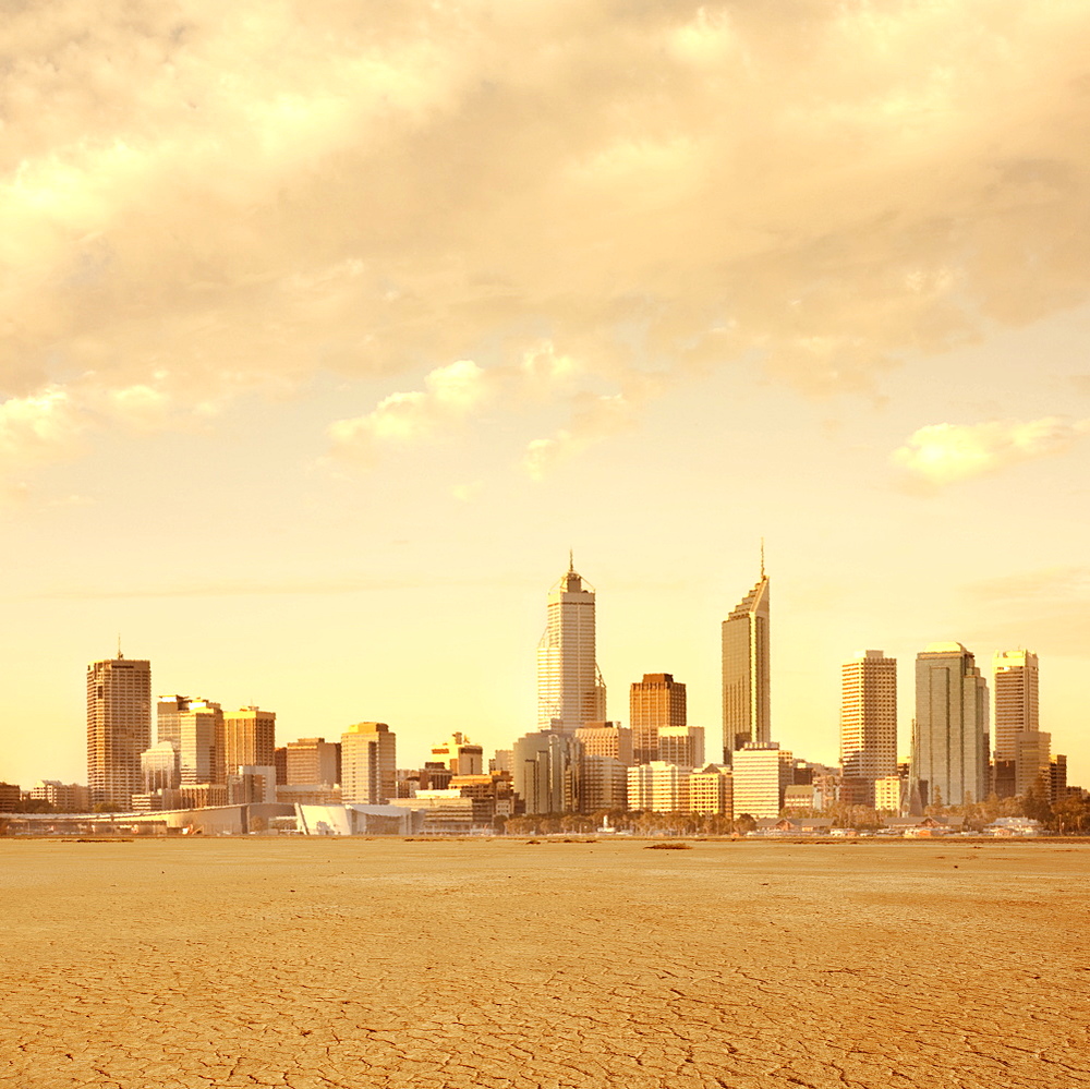 Skyscrapers with arid earth in foreground