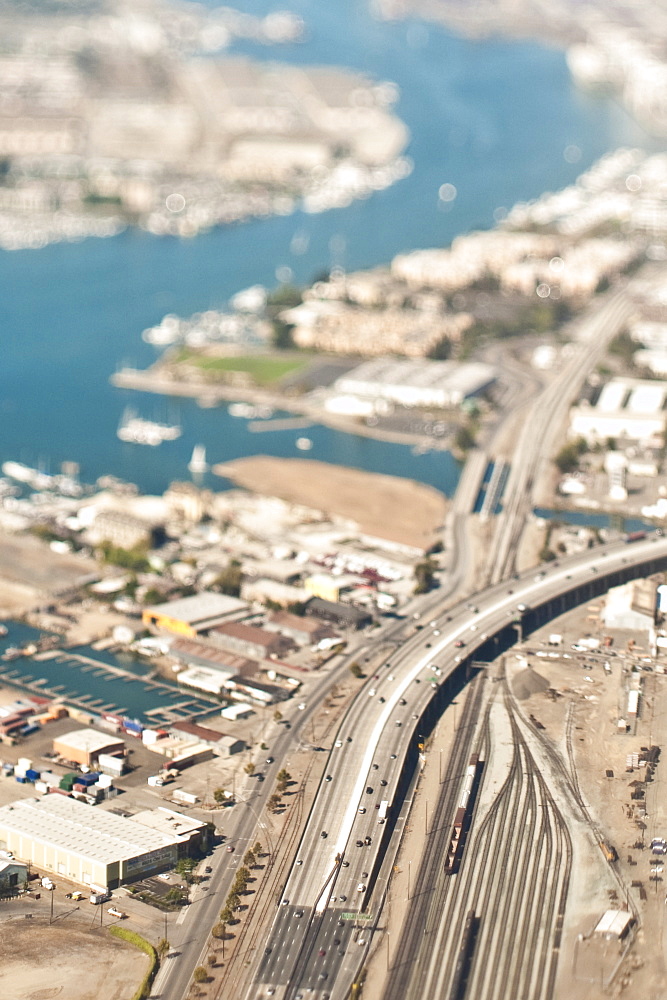 Highway and rail tracks in urban sprawl