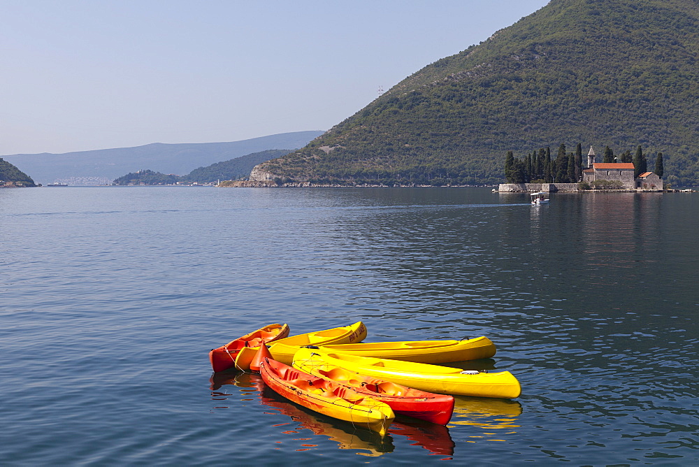 View of St. George Island with kayaks in the foreground, Perast, Bay of Kotor, UNESCO World Heritage Site, Montenegro, Europe