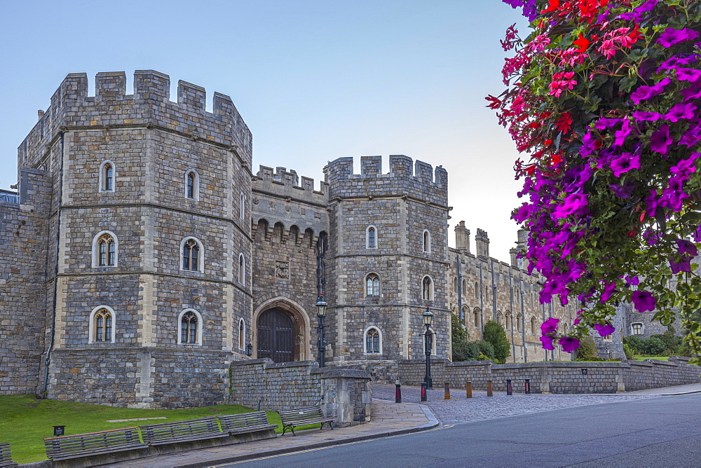 Windsor Castle in the morning with flowers in hanging baskets, Windsor, Berkshire, England, United Kingdom, Europe