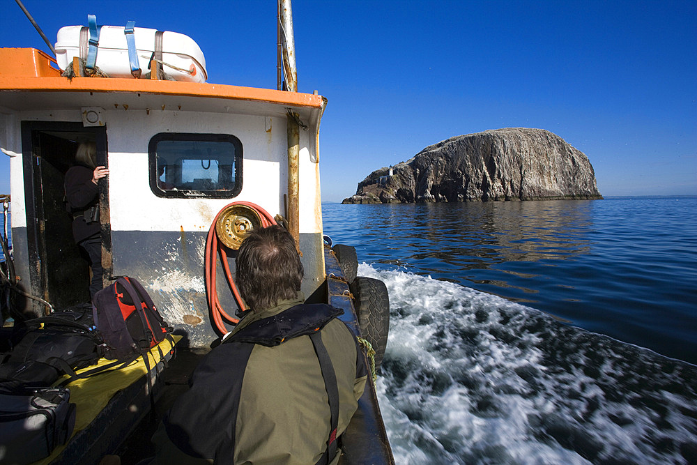 Boat approaching Bass Rock. Firth of Forth, Scotland, UK