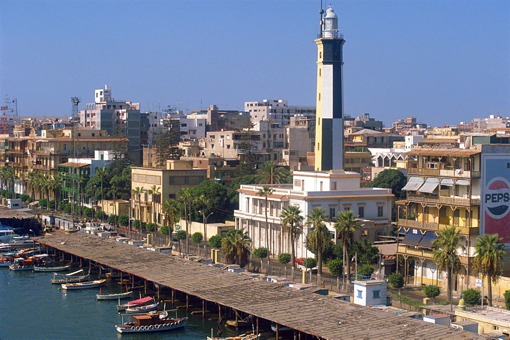 Waterfront skyline with lighthouse, Port Said, Egypt, North Africa, Africa