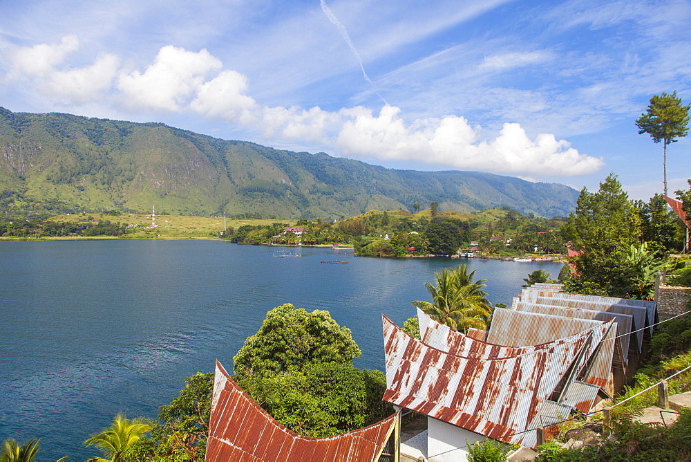 Typical Batak houses overlooking Lake Toba, Tuk Tuk, Lake Toba, Samosir Island, Sumatra, Indonesia, Southeast Asia, Asia