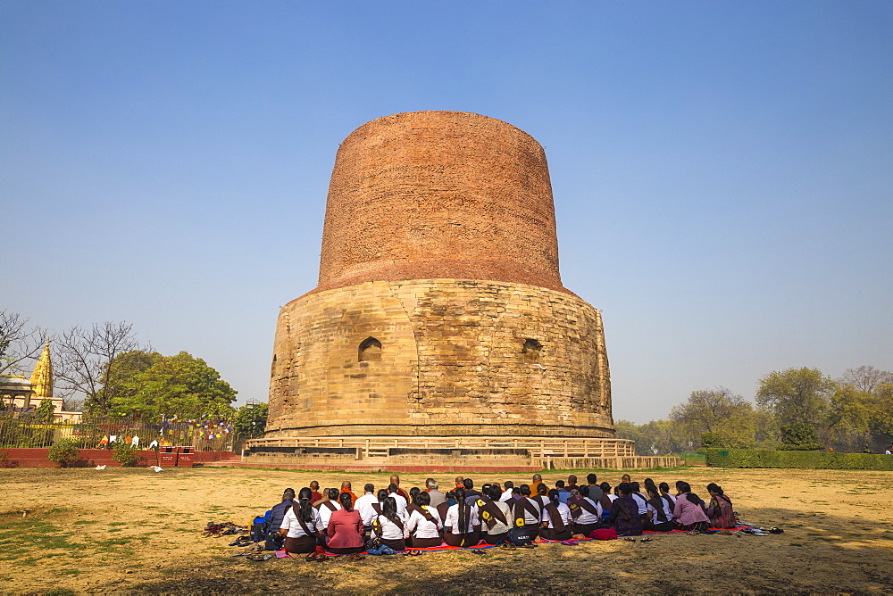 Pilgrims in front of the Dhamekh Stupa, Sarnath, Uttar Pradesh, India, Asia