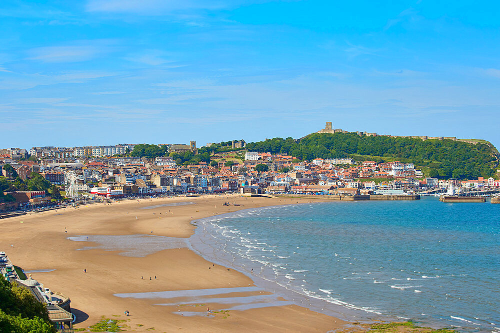 View of South Bay looking towards Scarborough Castle, Scarborough, Yorkshire, England, United Kingdom, Europe