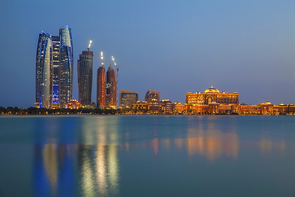 City skyline looking towards the Emirates Palace Hotel and Etihad Towers, Abu Dhabi, United Arab Emirates, Middle East