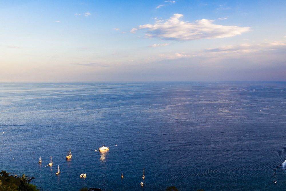 Boats on the Ionian Sea, part of the Mediterranean Sea at sunset, Taormina, East Coast of Sicily, Italy, Mediterranean, Europe 