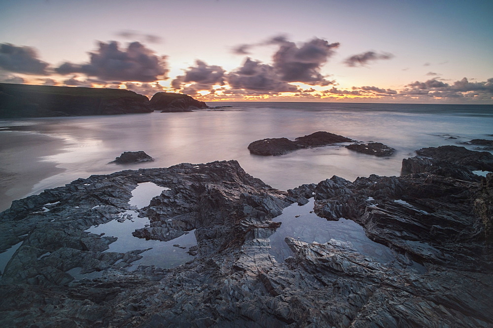 Rocky coast at Treyarnon Bay at sunset, Cornwall, England, United Kingdom, Europe