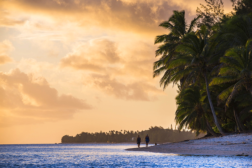 Walking along a tropical beach at sunset, Rarotonga, Cook Islands, South Pacific, Pacific