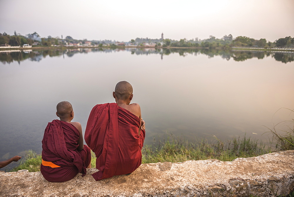 Buddhist Monks at Kandawgyi Lake at sunset, Pyin Oo Lwin (Pyin U Lwin), Mandalay Region, Myanmar (Burma), Asia