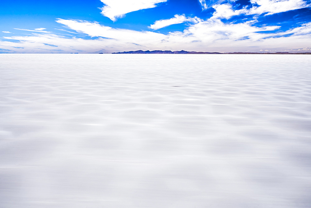 Driving through Uyuni Salt Flats (Salar de Uyuni), Uyuni, Bolivia, South America