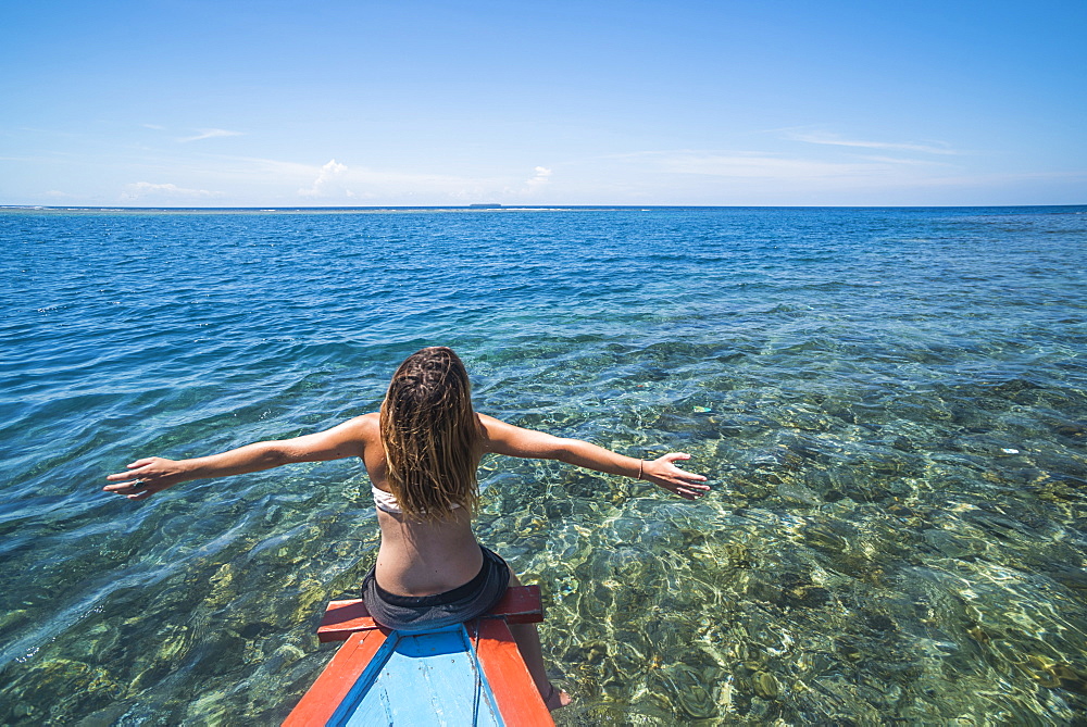 Woman on a traditional Indonesian boat trip to Marak Island near Padang in West Sumatra, Indonesia, Southeast Asia, Asia