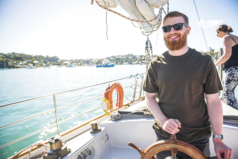 Tourist on a sailing boat trip in the Bay of Islands, from Russell, Northland Region, North Island, New Zealand, Pacific