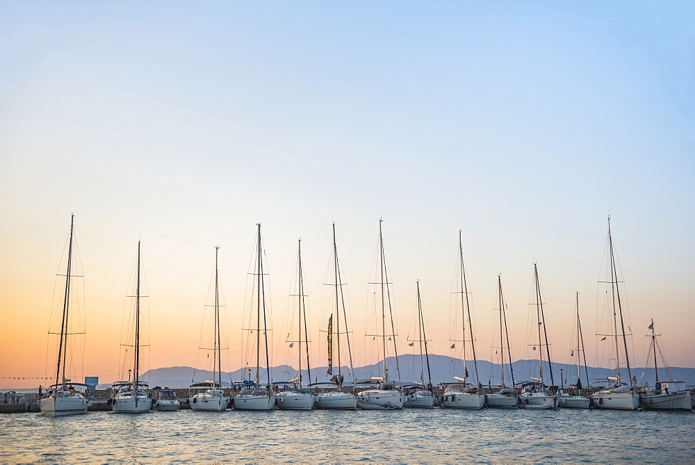 Sailing boats at sunset on Agistri Island, Saronic Islands, Greek Islands, Greece, Europe