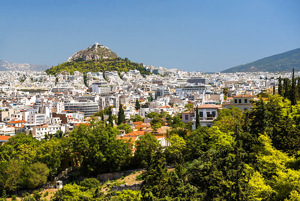 View of Athens and Likavitos Hill over the rooftops of the Plaka District from The Acropolis, Athens, Attica Region, Greece, Europe