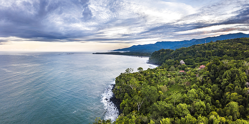 Drone view of Arco Beach and rainforest at sunrise, Uvita, Puntarenas Province, Pacific Coast of Costa Rica, Central America