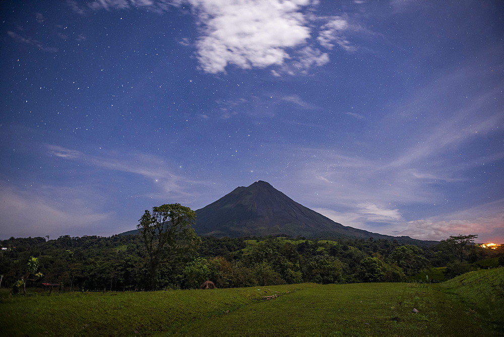 Arenal Volcano under stars at night, near La Fortuna, Alajuela Province, Costa Rica, Central America