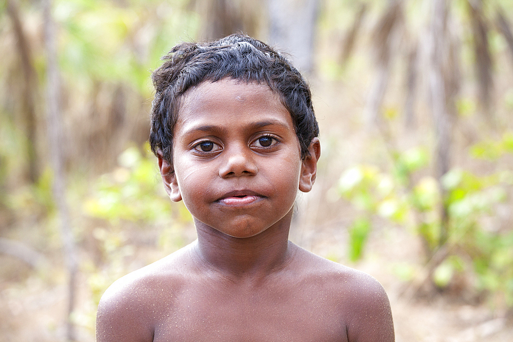 Young Aboriginal Yolngu boy in outback bush, Nyinyikay Homeland, East Arnhem Land, Northern Territory, Australia, Pacific