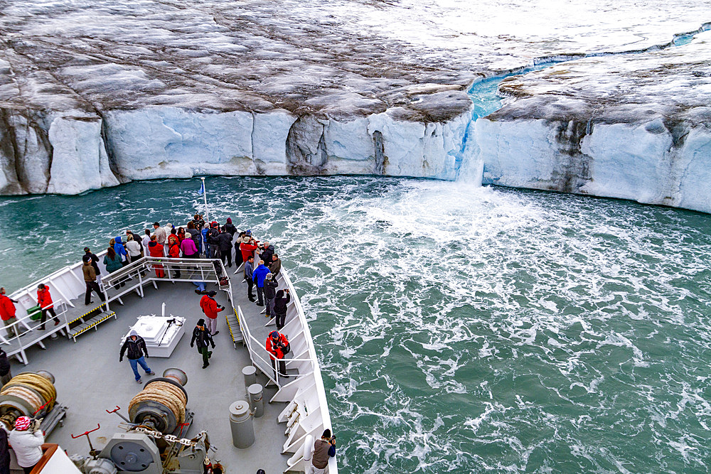 The Lindblad Expedition ship National Geographic Explorer near glacial run-off in the Svalbard Archipelago, Norway, Arctic, Europe