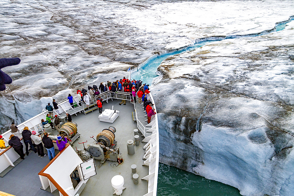 The Lindblad Expedition ship National Geographic Explorer near glacial run-off in the Svalbard Archipelago, Norway, Arctic, Europe