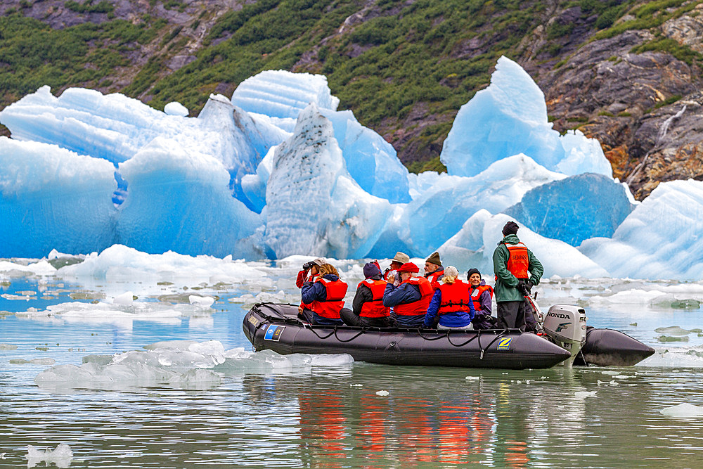 Guests from the Lindblad Expeditions ship National Geographic Sea Bird during Zodiac operations in Tracy Arm, Southeast Alaska, USA.