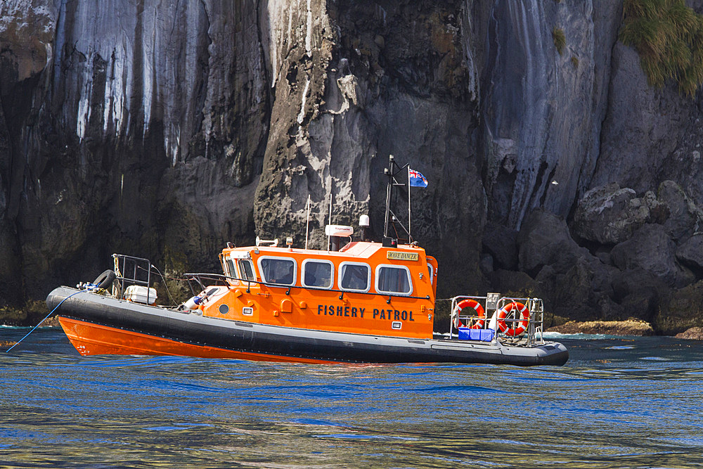 View of the rescue fishery patrol boat Wave Dancer at the wreck of the MS Oliva on Nightingale island, Tristan da Cunha Group, South Atlantic Ocean