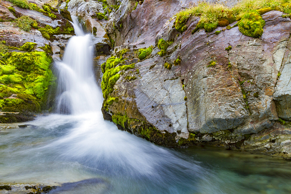 Views of a waterfall in Fortuna Bay on the northern coast of South Georgia, Southern Ocean, Polar Regions