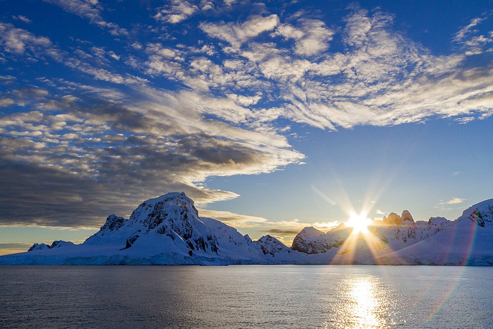 View of snow-capped mountains at sunrise in Neko Harbor in Andvord Bay, Antarctica, Polar Regions