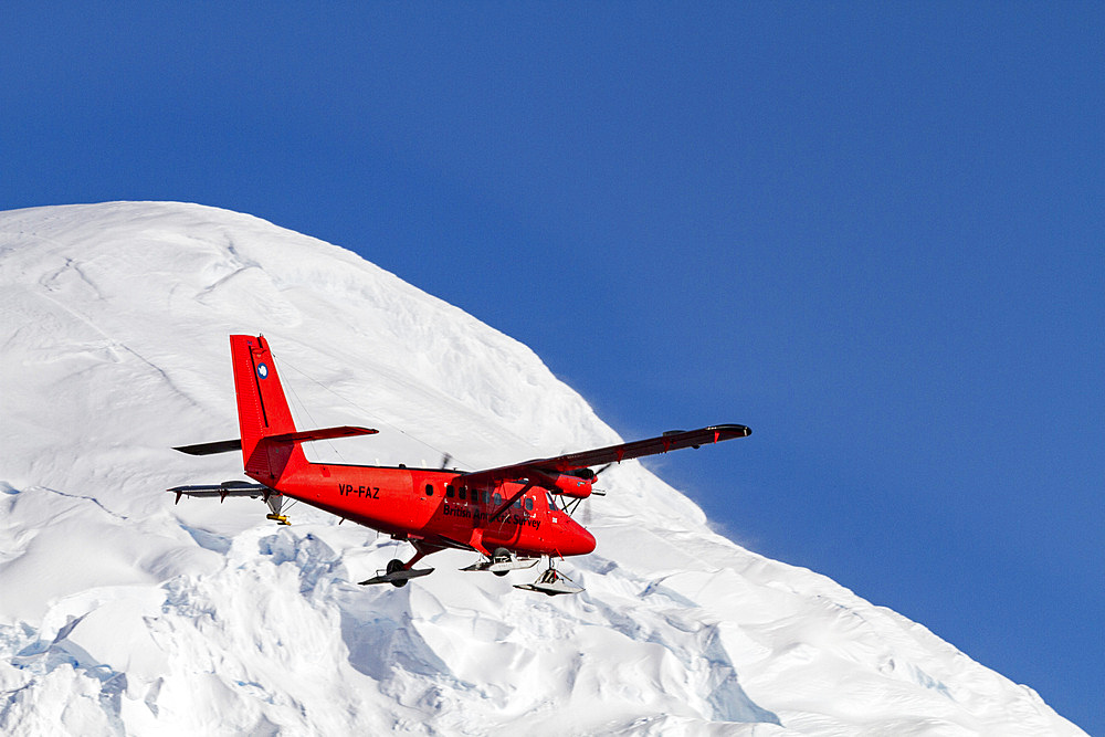 British Antarctic Survey (BAS) research plane operating in the Gullet, near Rothera Station near the Antarctic Peninsula, Polar Regions