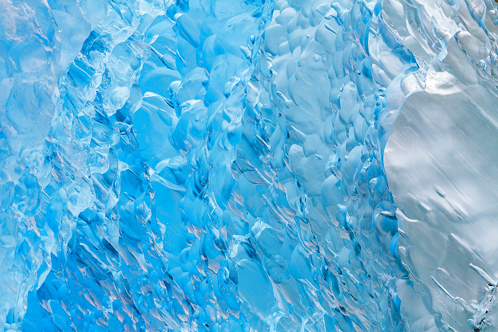 Glacial iceberg detail from ice calved off the Sawyer Glacier in Tracy Arm, Southeast Alaska, USA, Pacific Ocean.