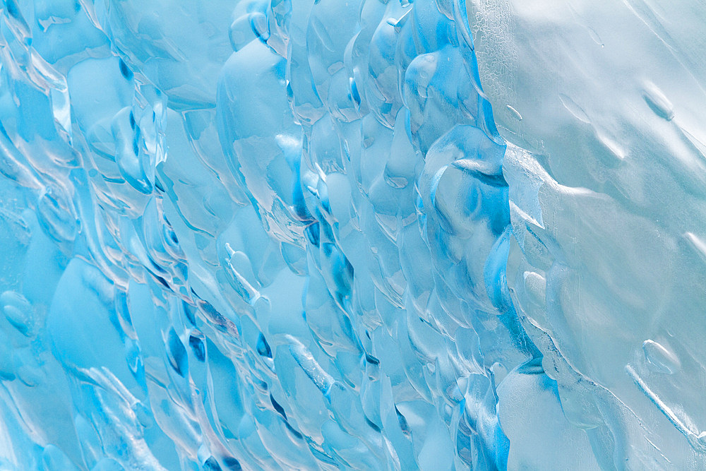 Glacial iceberg detail from ice calved off the Sawyer Glacier in Tracy Arm, Southeast Alaska, USA, Pacific Ocean.